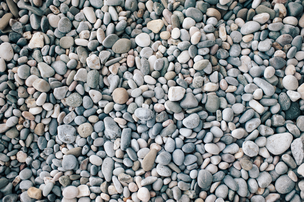 Fall Projects: The Best Time to Prepare Your Property for Winter Texture of beach pebble close up top view. Fall Projects: The Best Time to Prepare Your Property for Winter